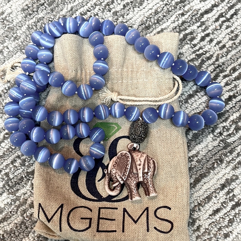 Gorgeous beaded necklace with elephant.